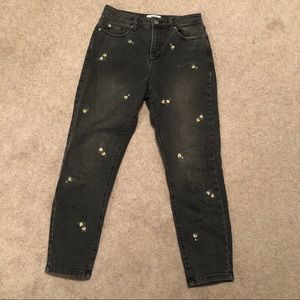 Black straight leg jeans with embroidered flowers